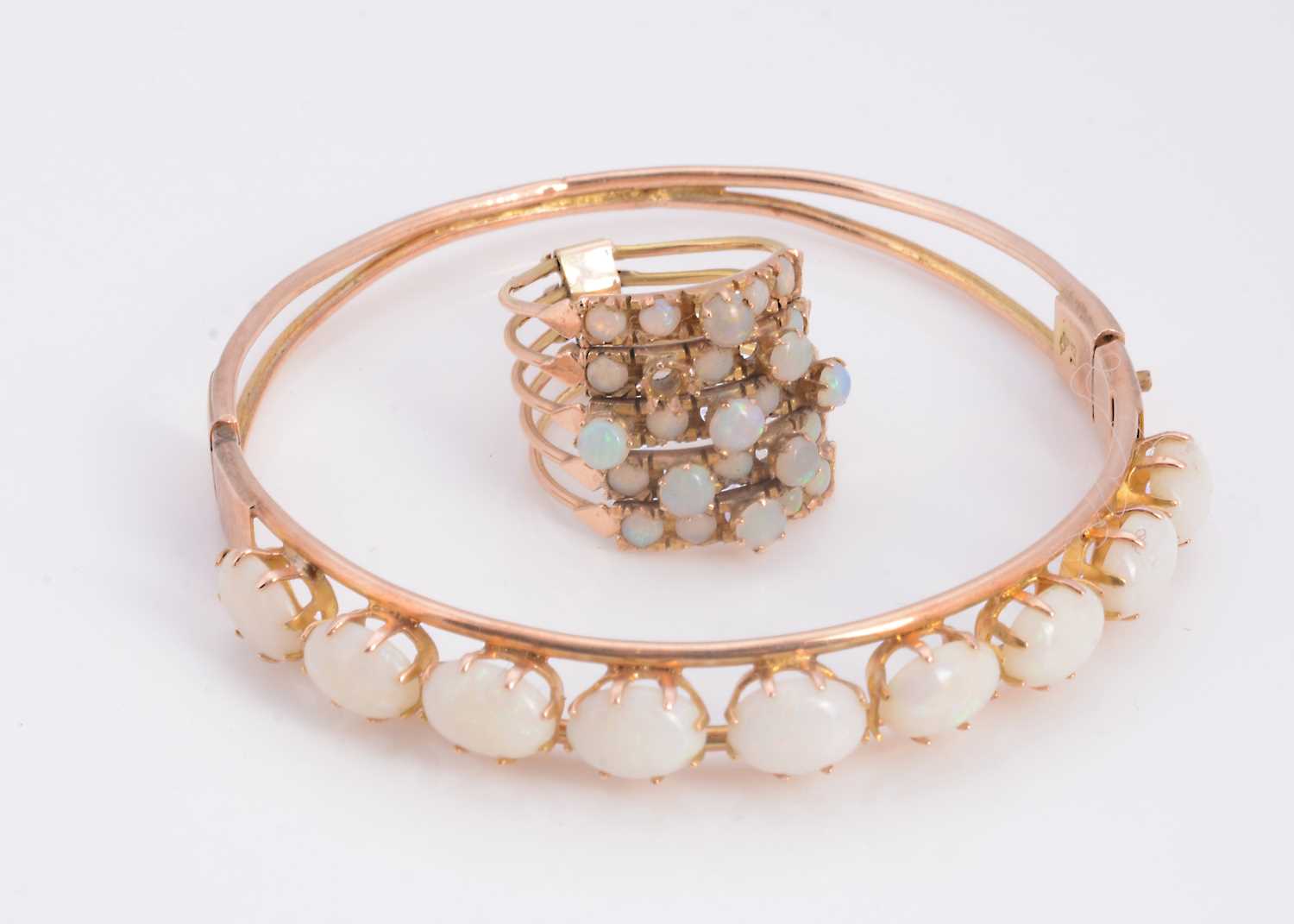 Lot 31 - A 14ct gold opal harem ring & 14ct gold 9 stone opal bangle