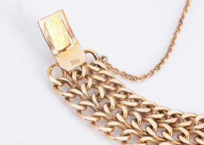 Lot 41 - A 18ct gold three strand curb bracelet