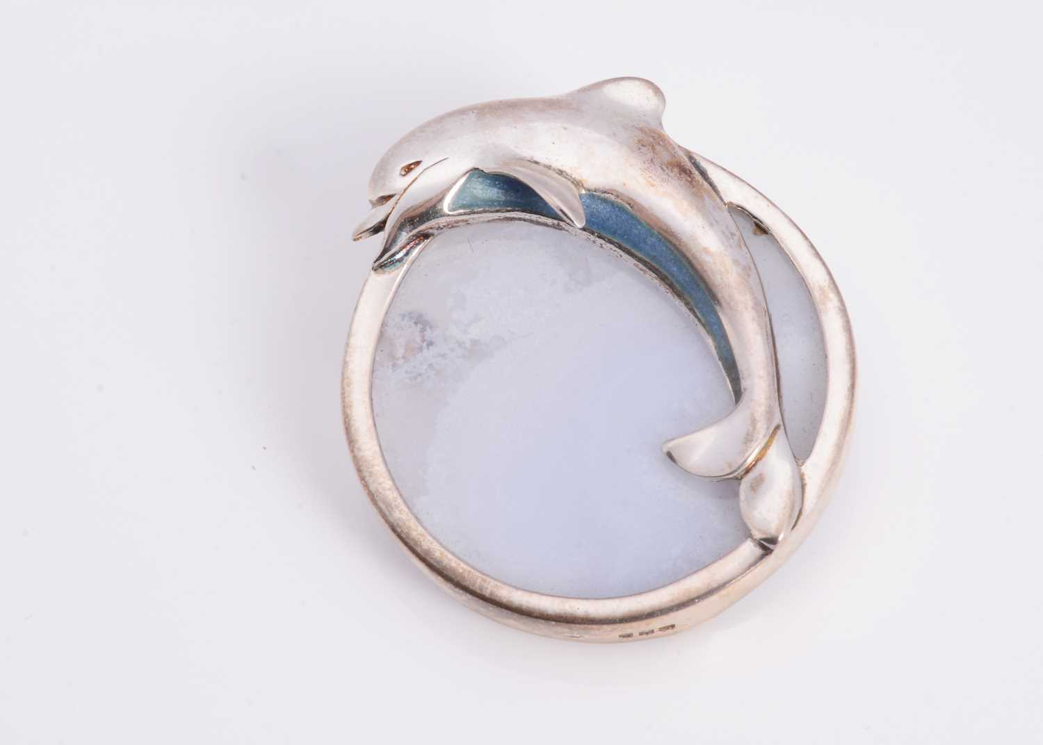 Lot 49 - A silver & glass Pat Cheney 'Chene d'Glas' dolphin brooch