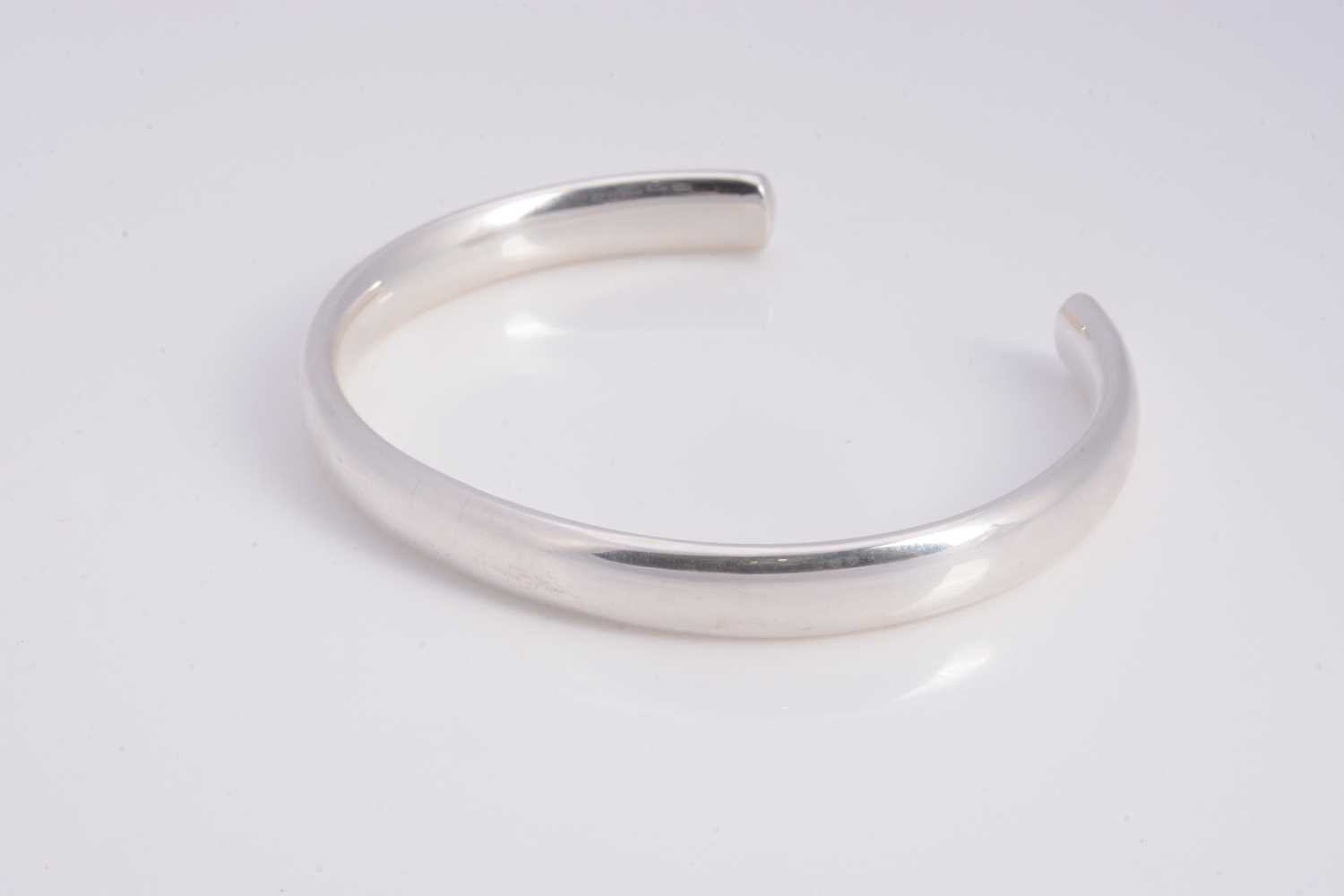 Lot 61 - A modern silver torque bangle