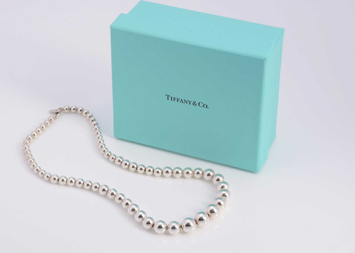 Lot 67 - A silver Tiffany & Co graduated ball necklace, in turquoise box marked Tiffany & Co