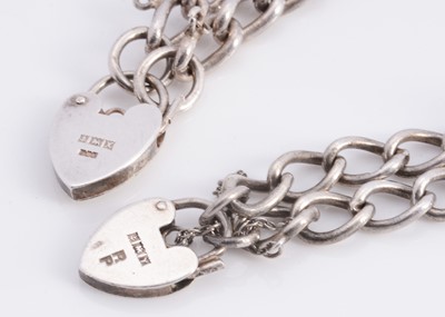 Lot 68 - A silver curb bracelets with padlocks