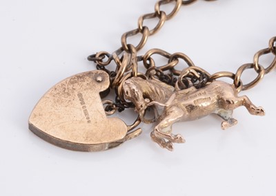 Lot 69 - A 9ct gold charm bracelet