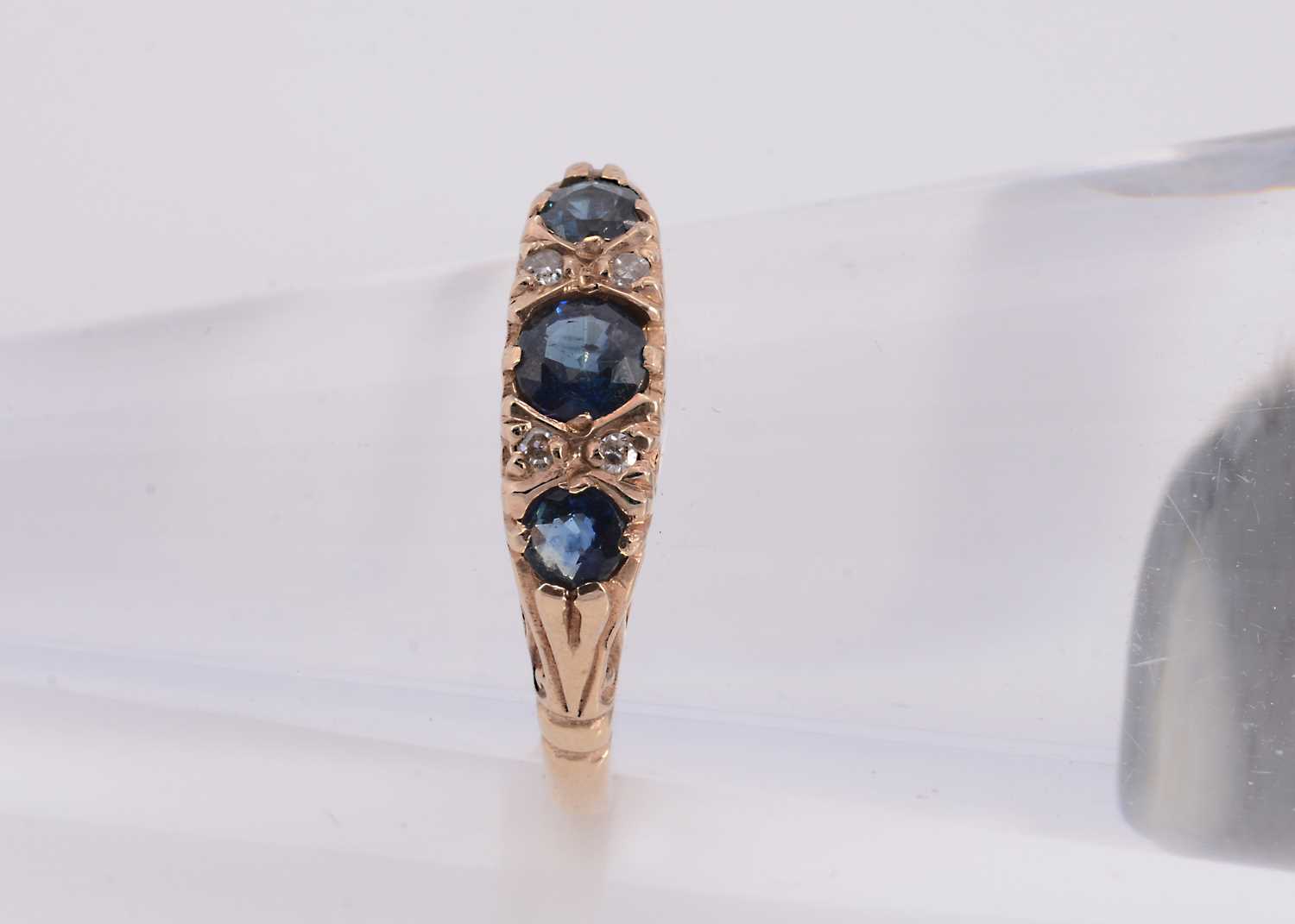 Lot 83 - A 9ct gold sapphire & diamond dress ring
