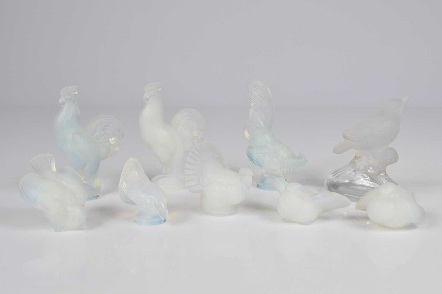 Lot 45 - Eight Art Deco Sabino glass bird figures and a similar bird
