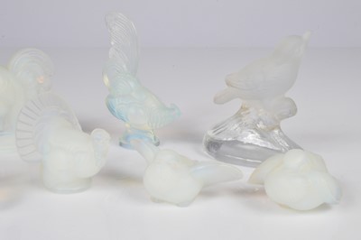Lot 45 - Eight Art Deco Sabino glass bird figures and a similar bird