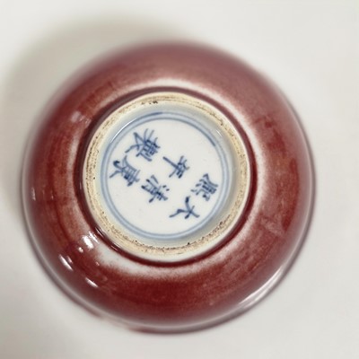 Lot 60 - A pair of Chinese Sang Du Beouf porcelain tea bowls