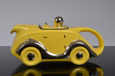 Lot 92 - Four Art Deco period Sadler Pottery racing car teapots