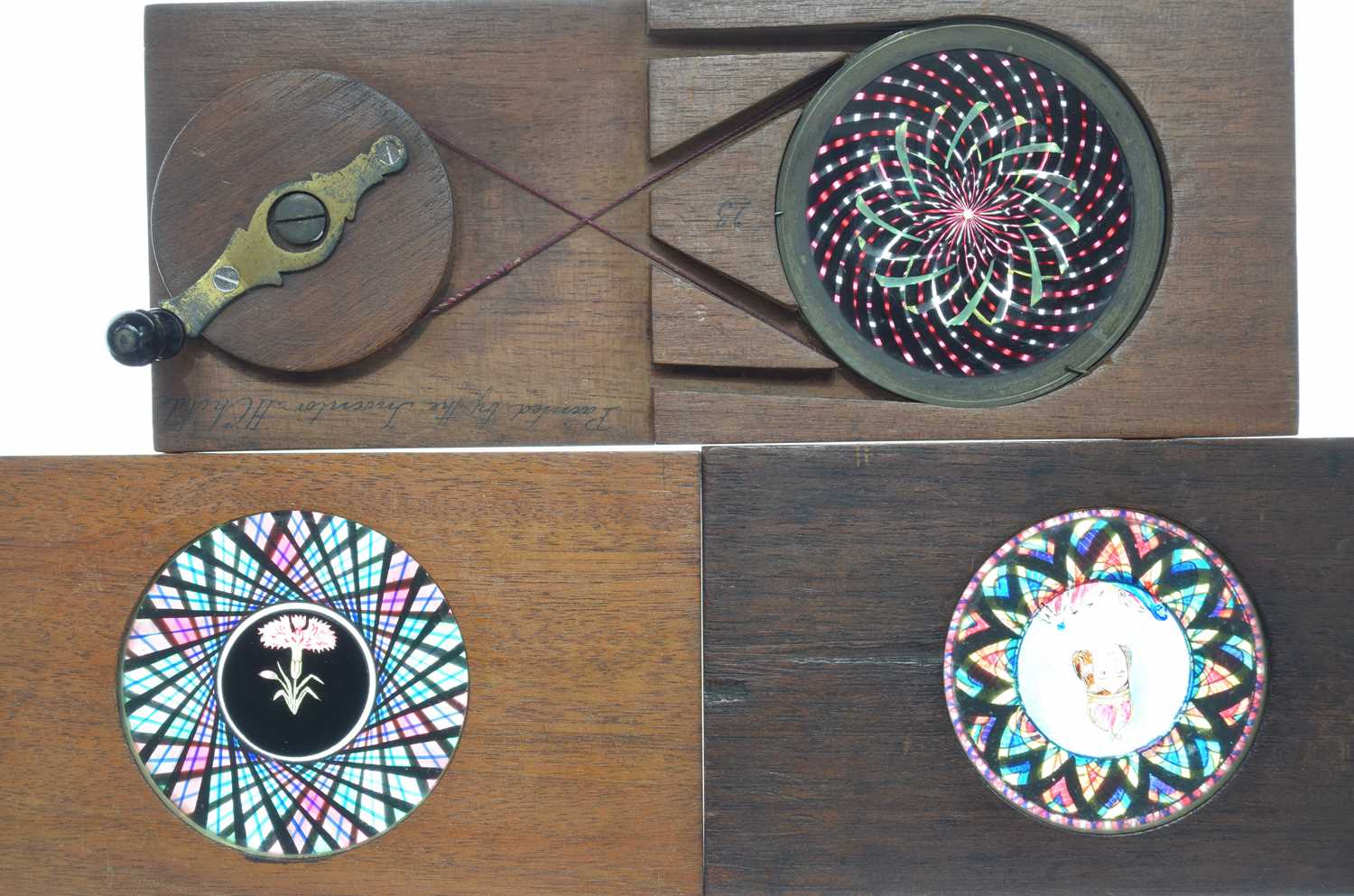 Lot 12 - Three Mahogany Mounted Kaleidoscopic Hand Cranked  Rotary Magic Lantern Slides