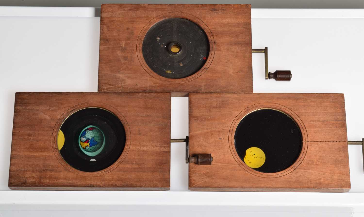 Lot 14 - Three Mahogany Mounted Hand Cranked Coloured Astronomy Hand Cranked Rotary Magic Lantern Slides