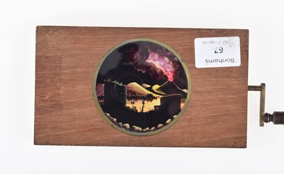 Lot 23 - Four Mahogany Mounted Hand Cranked Rotary and one lever Magic Lantern Slides